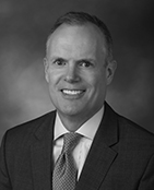 Photo of Charles E. "Chuck" Wall, Partner
